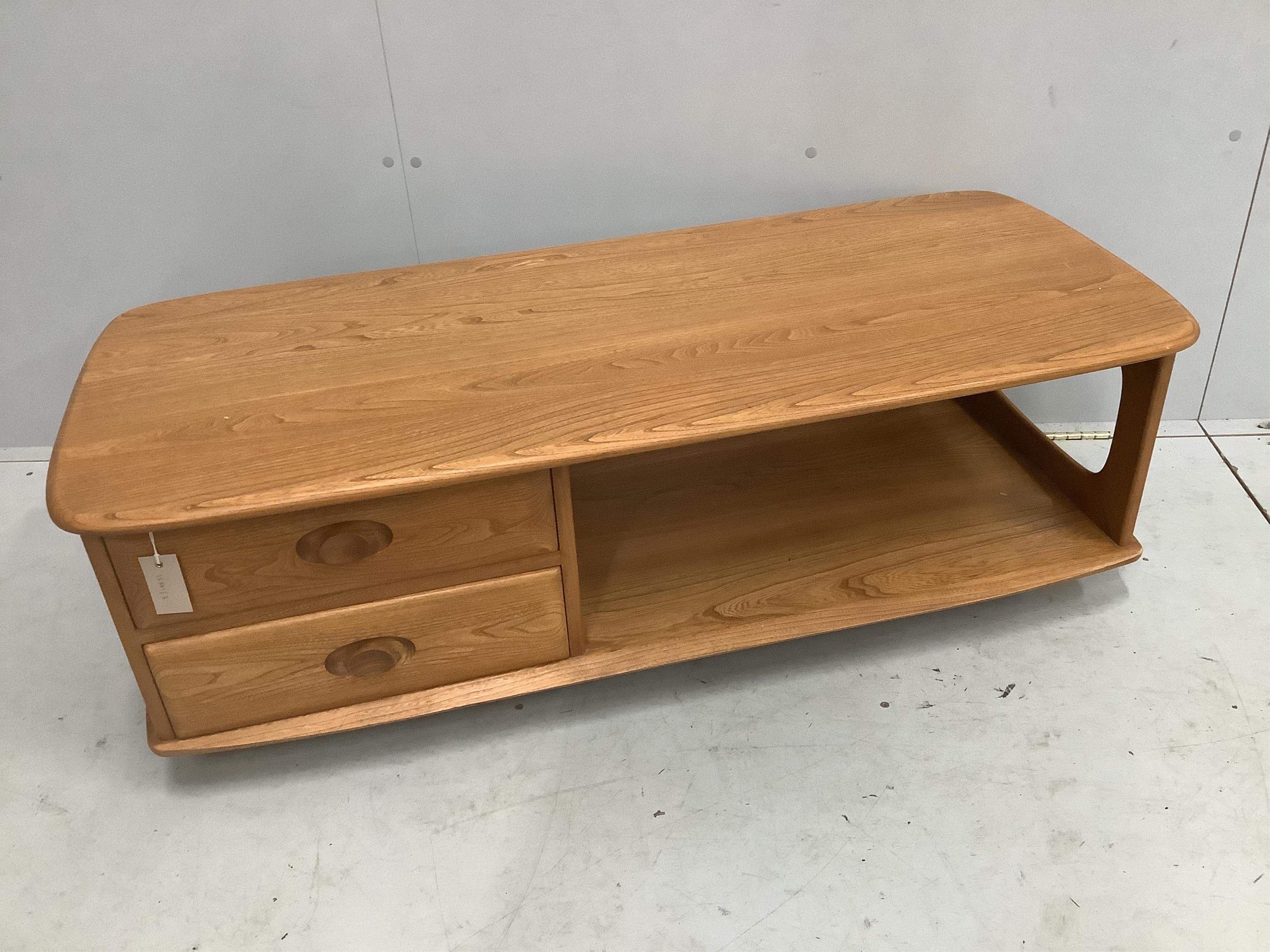 An Ercol Minerva elm television unit, width 124cm, depth 53cm, height 40cm. Condition - good